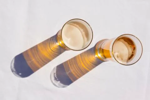 Two Beers with Shadow on Table Stock-Fotos