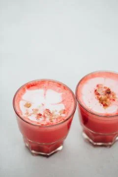 Two beetroot lattes Stock Photos