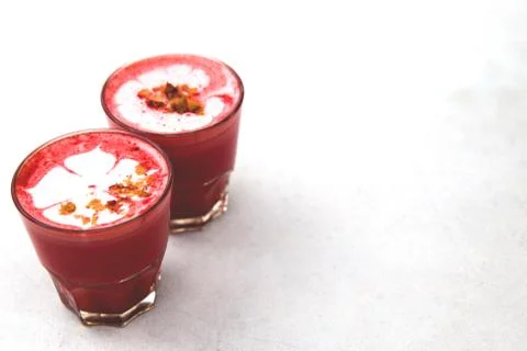 Two Beetroot super latte on marble background. Stock Photos