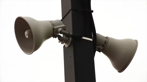 Two beige train station speakers pointing in opposite directions, fastened Stock Footage 246611770