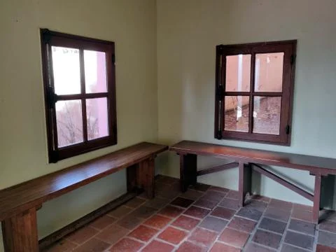 Two bench beside two windows Foto stock