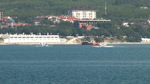Two Beriev Be-103 amphibious aircraft float like boats at sea in Gelendzhin Bay. Stock Footage 120777413