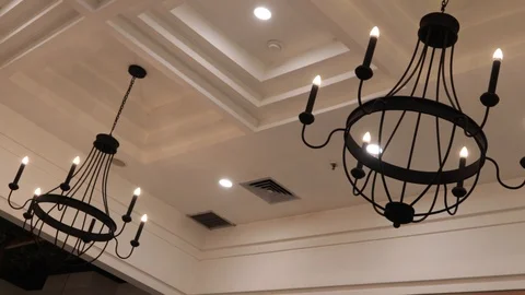 Two beuatiful decorative lights illuminate the place Stock Footage 119798804