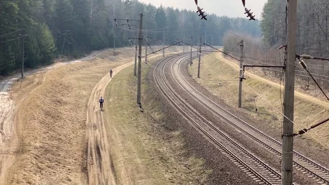 Two bicycles going along railway road. View from above Stock Footage 127305573