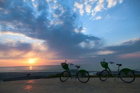 Two bicycles at sunset Stock Photos