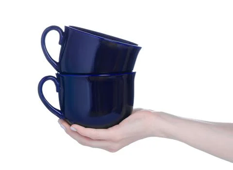 Two big blue cups mugs in hand Stock Photos