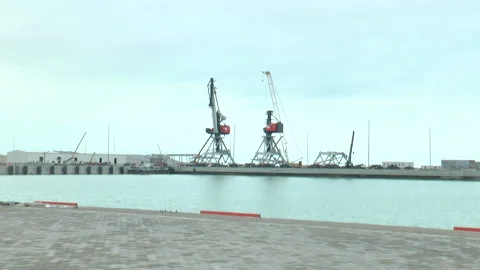 Two big cranes in the seaport In the general plan Stock Footage 232213621