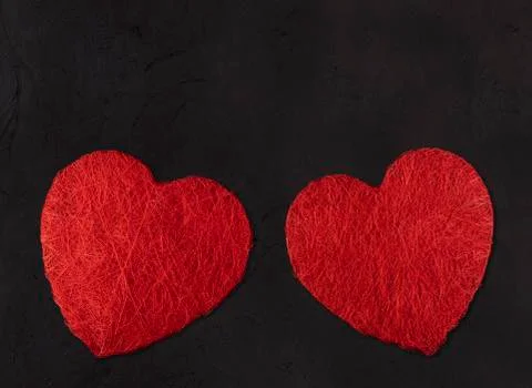 Two big hearts on a black background. valentines day concept Stock Photos