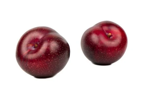 Two big red plums Stock Photos