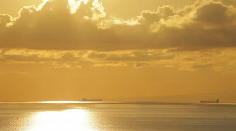 Two big ships is sailing on the sea. Scenic sunset, spectacular sky and clouds. Stock Footage 50134123