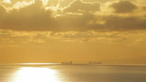 Two big ships is sailing on the sea. Scenic sunset, spectacular sky and clouds. Stock Footage 50134731