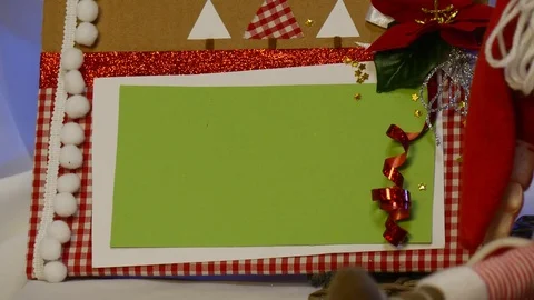 Two Big Spotted Boxes With Photo Frames Are Taken Away From Under a Christmas Stock Footage 72548197