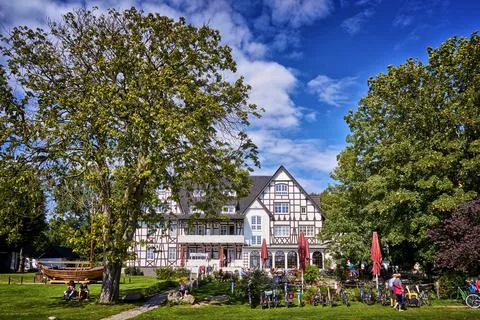 Two big trees Half-timbered house in Kloster on the island Hiddensee. Stock Photos