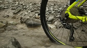 Two bikers biking on the river  slow motion Stock Footage 85668314