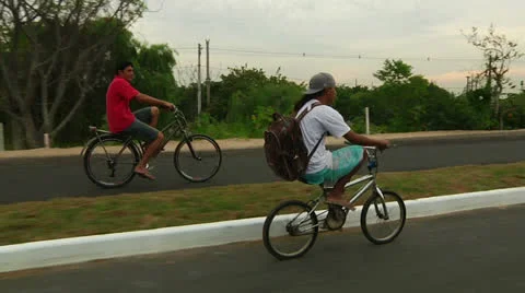 Two bikers ride along with camera (PoAbikes29) Video stock 23733218