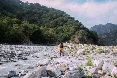 Two bikers into the river Photos