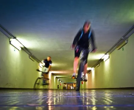 Two bikers in a tunnel Stock Photos