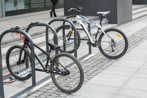 Two bikes on the Bicycle parking Stock Photos