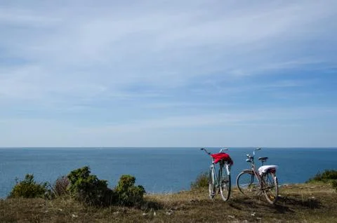 Two bikes by the coast Stock Photos