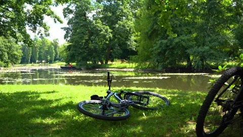 Two bikes near river Stock Footage 340639249