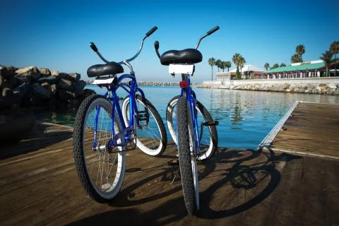 Two bikes on a pier. Stock Photos