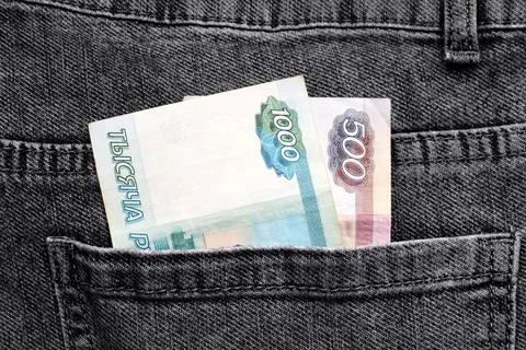 Two bills of Russian rubles in the back pocket of jeans Stock Photos