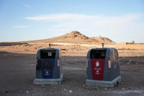 Two bin containers with the desert in the background Foto stock