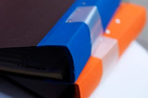 Two binders lying on the office table Stock Photos