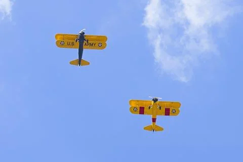 Two biplanes flying overhead. Stock Photos