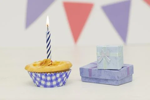 Two birthday gift box with cupcake on wood background Stock Photos