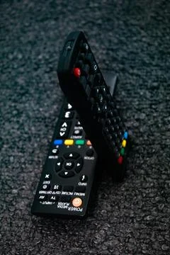 Two Black appliances remote control showcasing sleek design Stock Photos