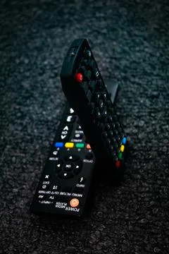 Two Black appliances remote control showcasing sleek design Stock Photos