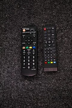 Two Black appliances remote control showcasing sleek design Stock Photos