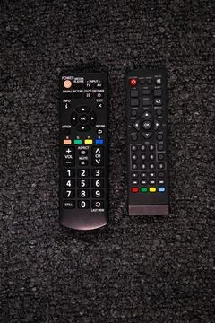 Two Black appliances remote control showcasing sleek design Stock Photos