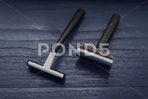Two black blade on a dark background Stock Photos