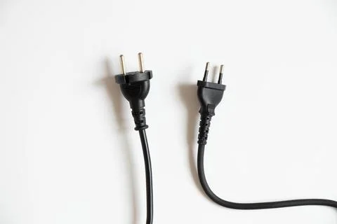 Two black cables with plugs on a white background, cable Stock Photos