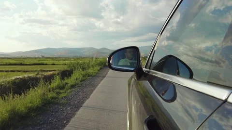 Two black cars chasing on rural road Stock Footage 330101281