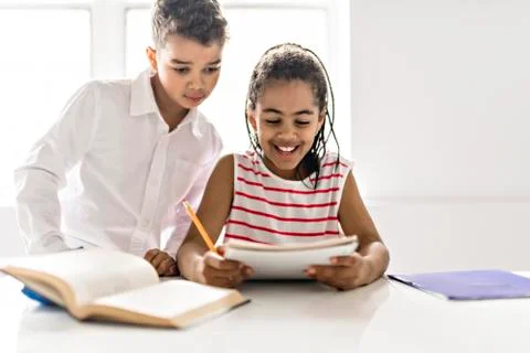 Two Black child doing homework at home Stock-Fotos