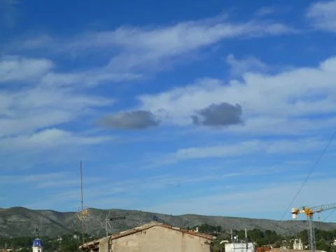 Two black clouds Stock Photos