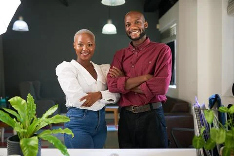 Two Black co-founders pose with arms crossed with their new business Stock Photos