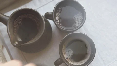 Two black coffee cups and clay ibrik on the wooden salver Stock Footage 69777407