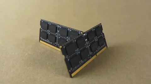 Two black computer memory RAM chips rotating Stock Footage 344855237