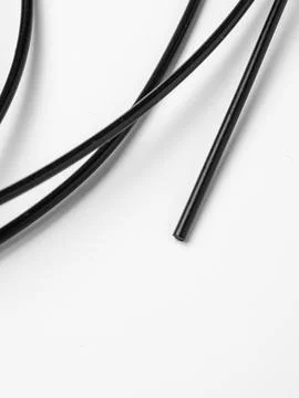Two black cords diagonal studio shot Stock Photos
