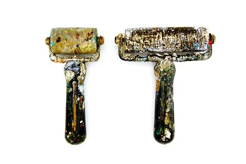 Two Black dirty paint roller be stained color isolated on white background Stock Photos