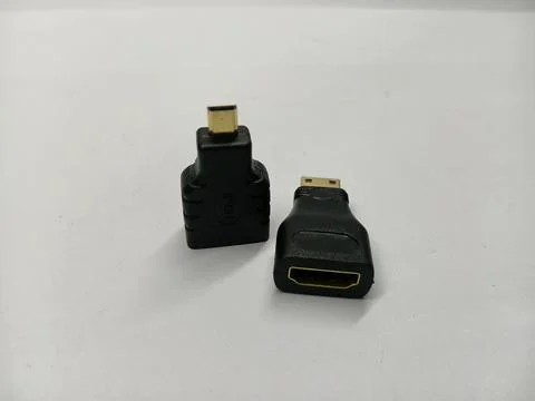 Two black HDMI to Micro HDMI adapter converters on white background Stock Photos