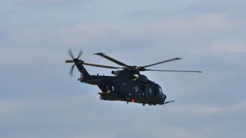 Two black helicopters fly close together in straight line Video stock 163302394