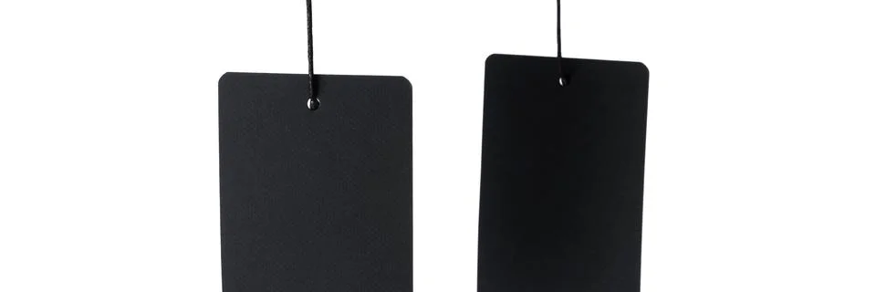 Two black label on thread on white background, isolated. Stock Photos