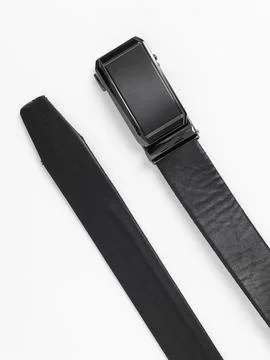 Two black leather belts coiled side by side Stock Photos
