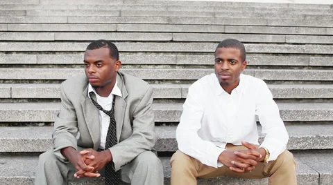 Two black men sit on stairs and wait for someone Видео 55047644