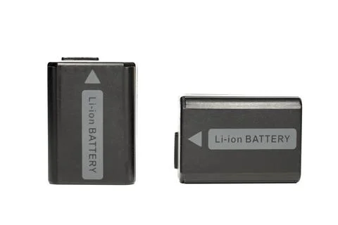 Two black plastic lithium ion batteries for sony photo camera with pure white Stock Photos